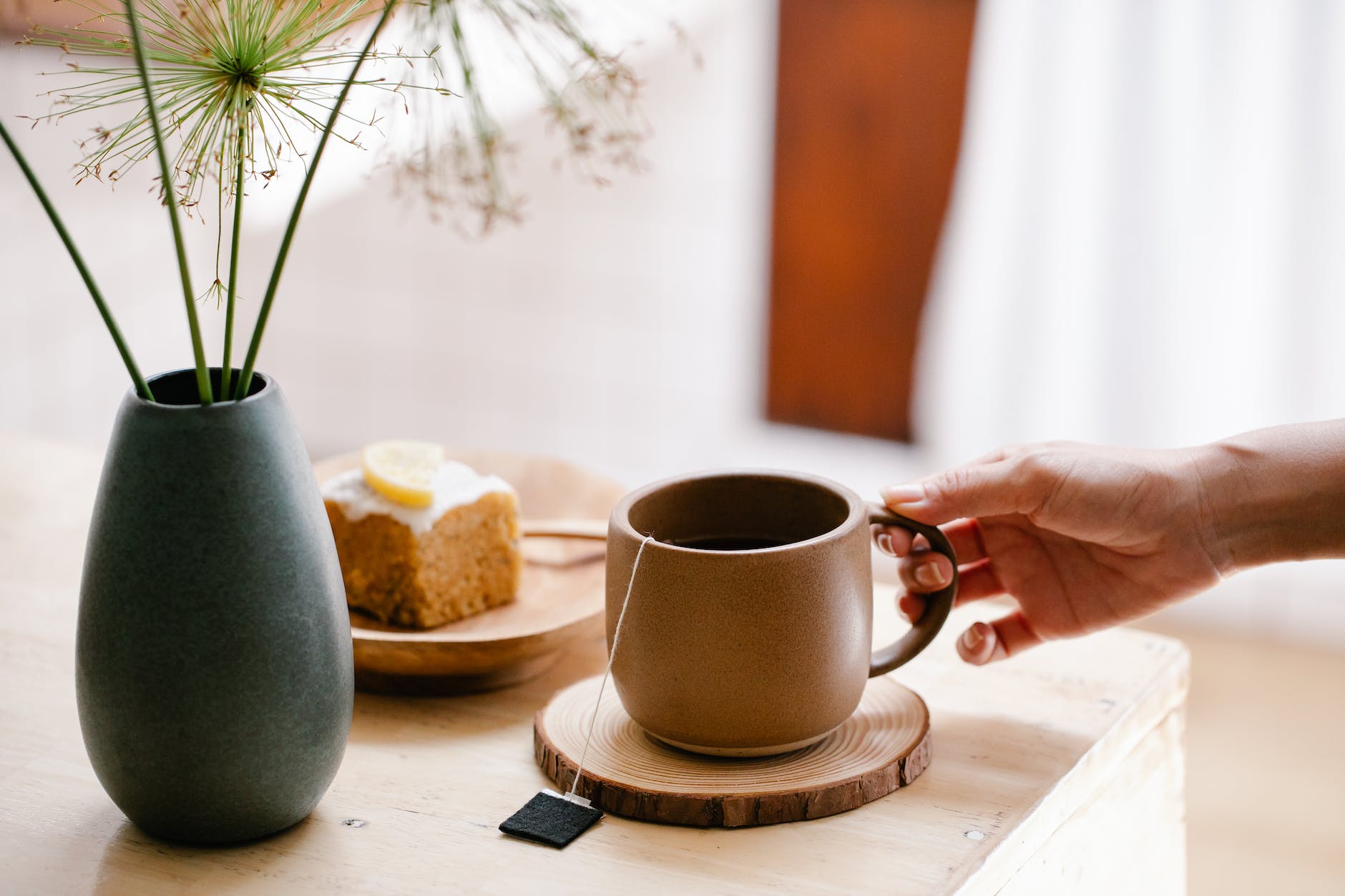 ceramic mug on brown wooden coaster